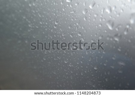 Rain on silver surface