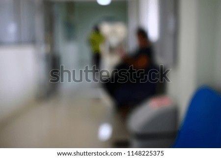 Silhouette and blurry background of people sit on the waiting area wait for contact a government transaction affair service.