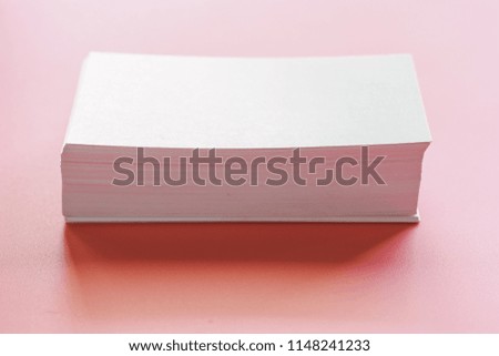 Selective focus of blank business cards on pink background