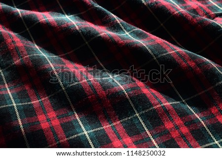 Tartan Material Fabric with Sunlight and Shadow Highlighting Details and Patterns Royalty-Free Stock Photo #1148250032