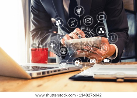 businessman or Designer using smart phone with laptop and digital tablet computer and document on desk in modern office with virtual interface graphic icons network diagram
 vintage tone