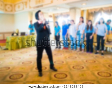 The host is describing the activities of the seminar to employees. Abstract image blur.