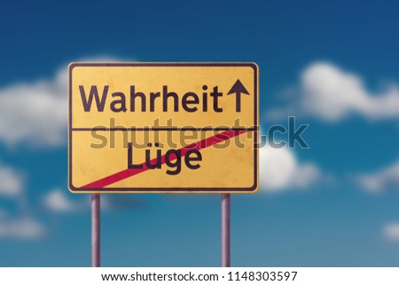 truth and false - yellow traffic sign with inscriptions in German