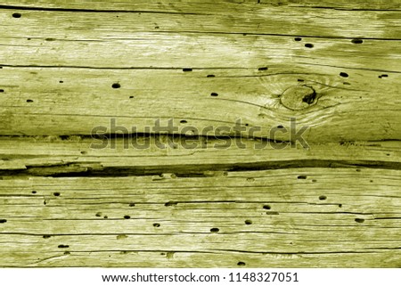 Old grunge wooden fence pattern in yellow tone. Abstract background and texture for design.