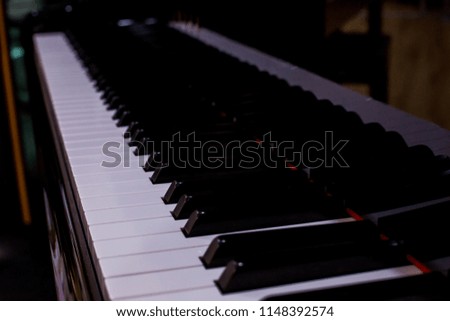 Side view of instrument musical tool. Close up to the piano keyboard background with selective focus. Classical music with black and white key.