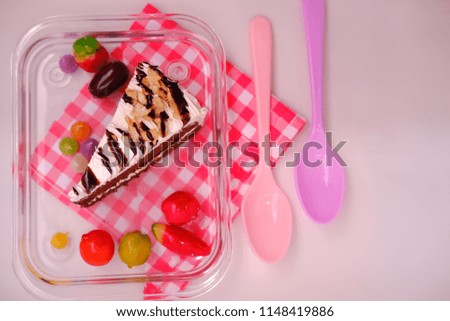 colorful chocolate cake and cream on white background