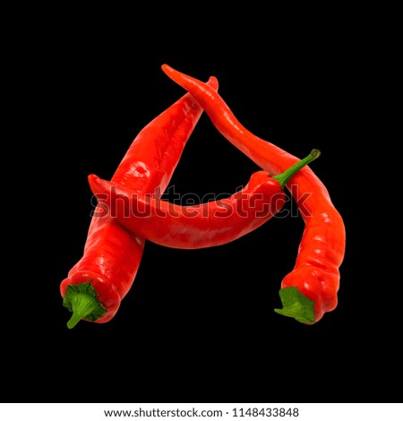Letter A composed of ripe red chili peppers. Isolated on black background.