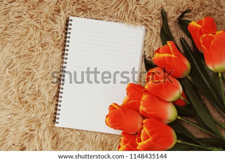 space copy on notebook and flower mock up flat lay
