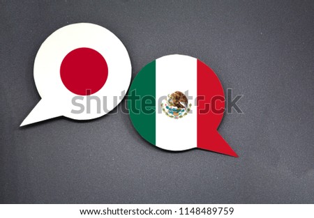 Japan and Mexico flags with two speech bubbles on dark gray background