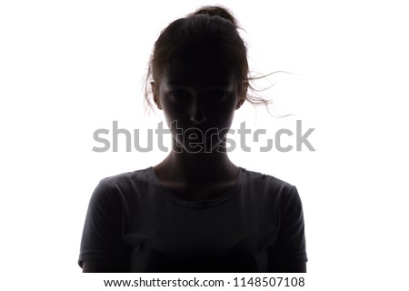 silhouette of a serious and confident young woman looking straight, beautiful girl on a white isolated background, concept beauty and fashion