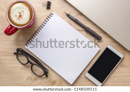 Top view table with copy space ,office desk workplace with coffee cup on wooden background.Flat Lay 