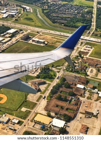 Airplane wing over Houston 