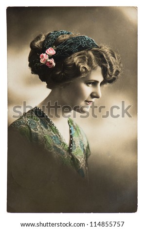young sentimental woman with flowers. vintage picture ca. 1913