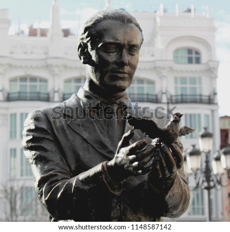Statue of the famous poet, Federico García Lorca with a pigeon on Saint Anne Square (Plaza de Santa Ana) in Madrid, Spain, Europe. Old town neighborhood in the true inner city of Madrid. Royalty-Free Stock Photo #1148587142