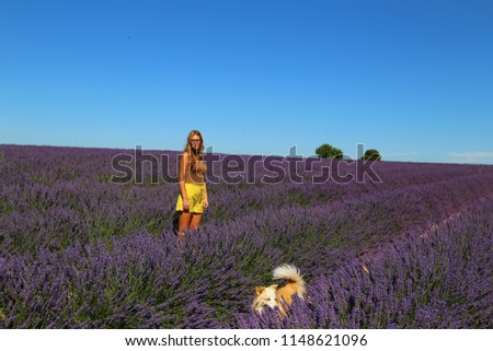 Joyful and happy woman in a beautiful lavander field