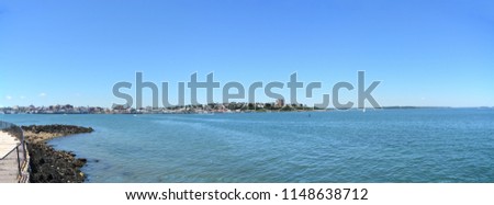 A large panoramic image of Portland Maine as seen from across the harbor.