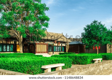 City wall garden and building with blue sky at Pingyao Ancient City, China