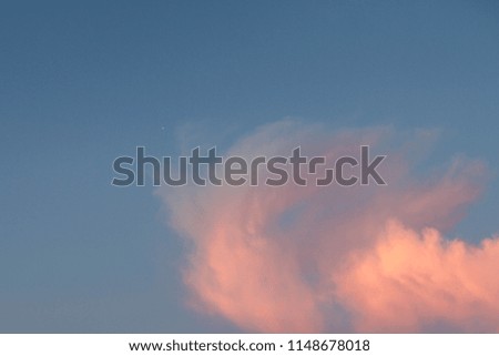 pink clouds on a blue background