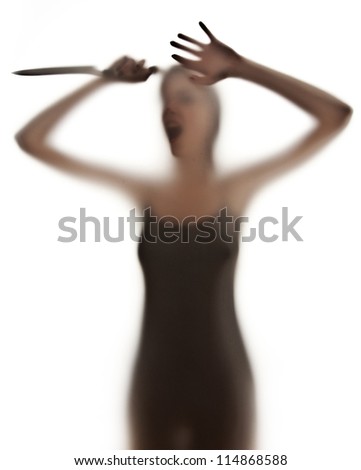 silhuette of a woman with a knife- violence concept