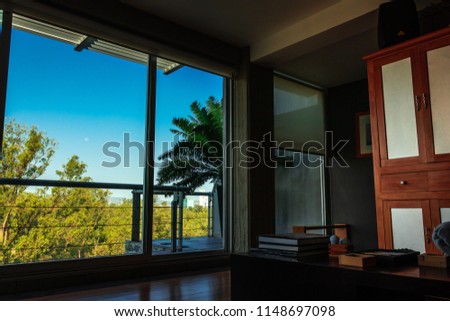 View of Mexican skyline from the inside of an apartment.