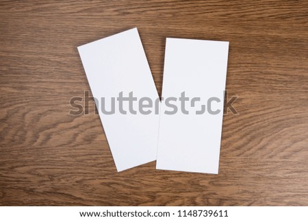 Blank flyer over wooden background to replace your design