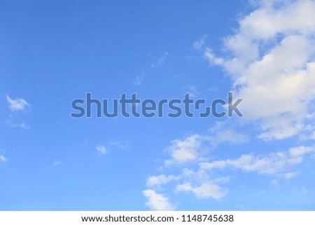fluffy white clouds on a clear blue sky