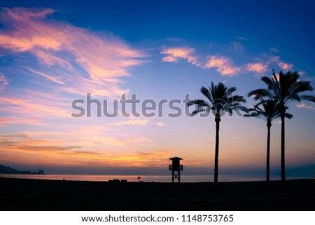 the sun rising over the horizon with a blue sky and clouds scattered across the sky