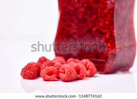 raspberry jam with raspberry isolated  on white background