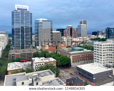 Looking out at downtown Portland, Oregon from a high rise building.