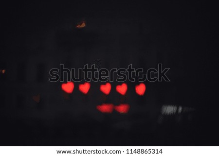 Five blurred red hearts for saint valentine's Day background to show love. The bokeh effect make the picture magical