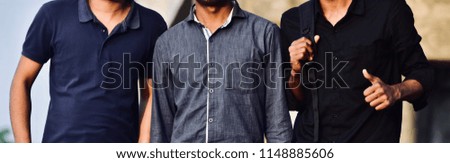 Three men wearing stylish dresses standing in a place unique photo