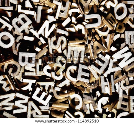 Jumbled letters made of wood close up