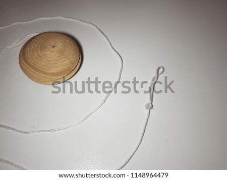 wooden yo-yo toy isolated on white background