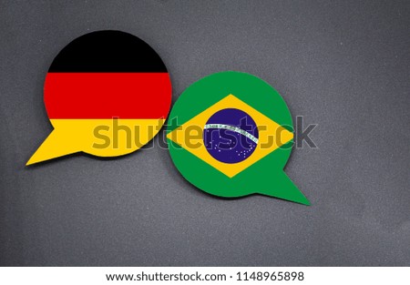Germany and Brazil flags with two speech bubbles on dark gray background