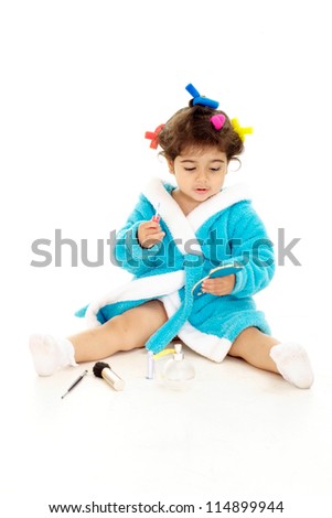 Amusing little girl resting at home on a white background