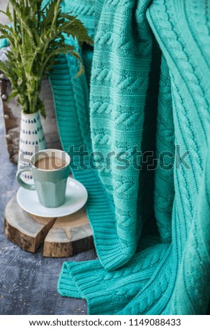 coffee and mint green blanket