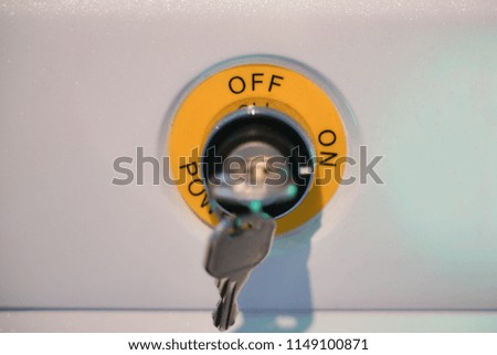 key in key-hole and starts the engine