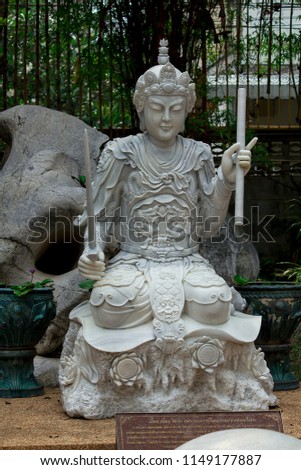 Statue carved from marble in Chinese style.