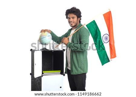 Young man with Indian flag or tricolour with world globe on white background, Indian Independence day, Indian Republic day