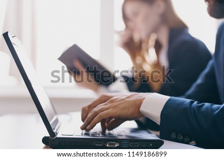  Business people working in a laptop business office.                              