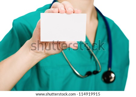 Woman doctor showing business card on a white background.