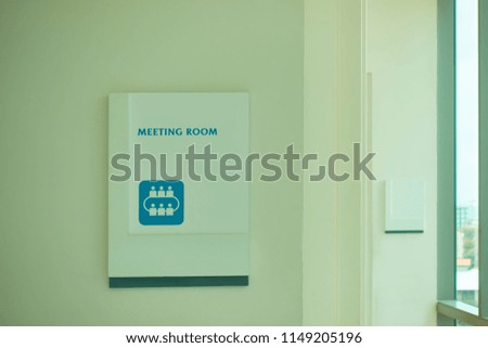 The meeting room white sign on the wall with copy space.                            