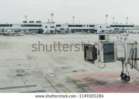 Airplane bridge in airport for passengers boarding or Jetway waiting for a plane to arrive on airport or airport terminal boarding gate.