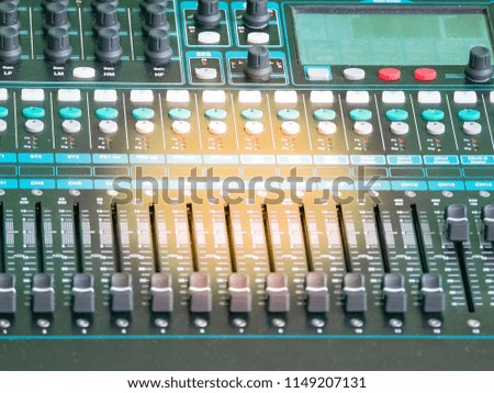 sound panel control of music mixer studio recording with yellow light beam