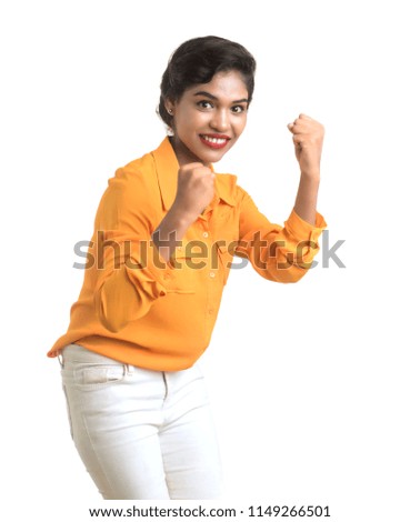 Smiling cheerful girl showing sign isolated on white background