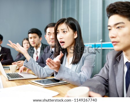 young asian business woman executive engaging in a heated discussion during meeting. Royalty-Free Stock Photo #1149267740