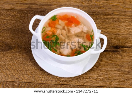 Chicken soup with carrot and herbs