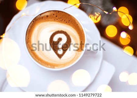 Coffee cup with question mark in the froth concept for problems, uncertainty and asking questions