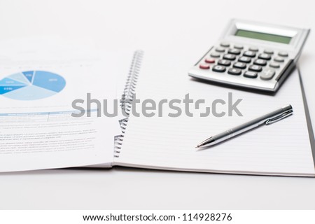 Office desk with supplies business silver pen on open notepad