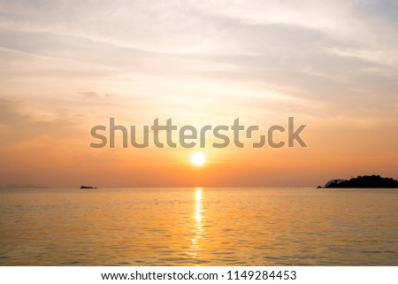 Beautiful of sunrise with colorful sky in summer time concept travel, holiday and vacation. Tropical paradise beach nature landscape at Lipe island in Thailand.